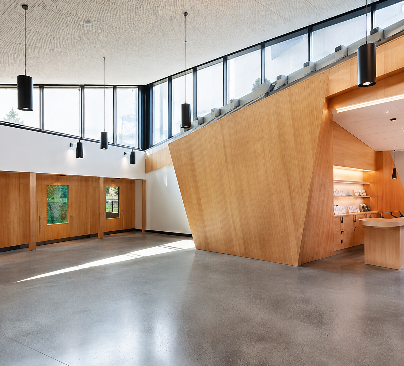 The West Kootenay Gateway Visitor Centre interior with wood panelling and natural light