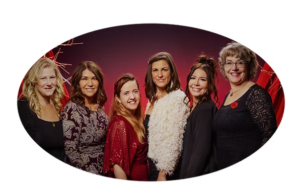 The Confluence team — six women standing together in a group portrait